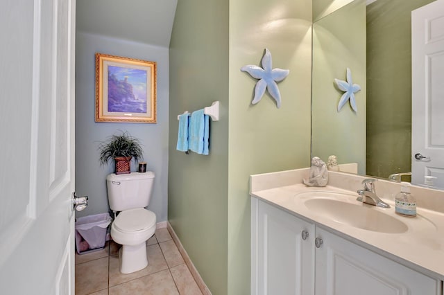 bathroom featuring tile patterned floors, toilet, and vanity