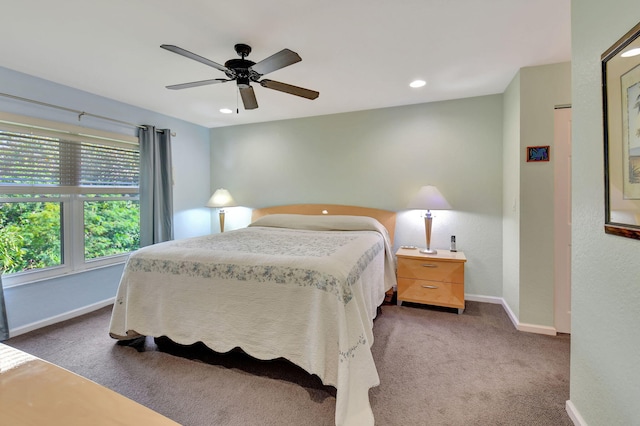 carpeted bedroom with ceiling fan