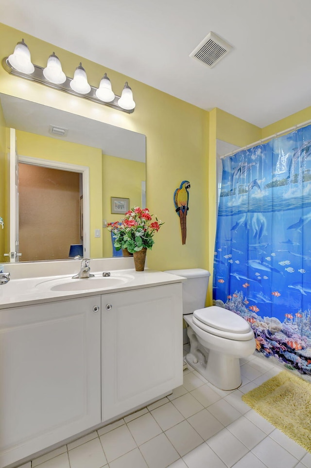 bathroom featuring tile patterned floors, vanity, toilet, and a shower with shower curtain