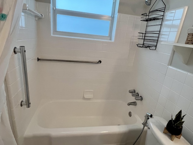 bathroom featuring shower / bathtub combination with curtain and toilet