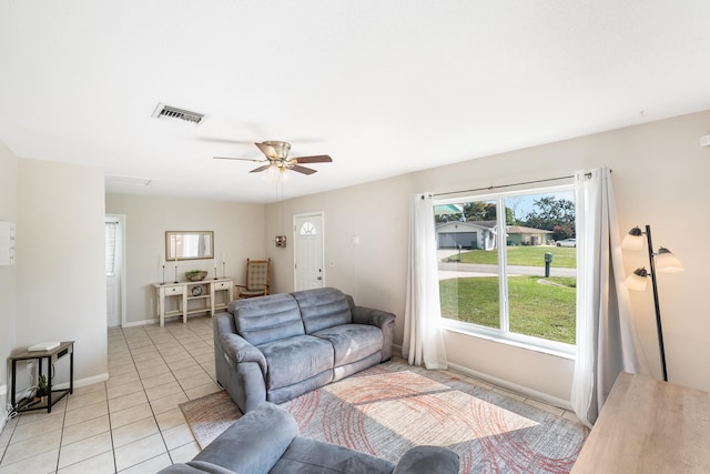 living room with light tile patterned floors and ceiling fan