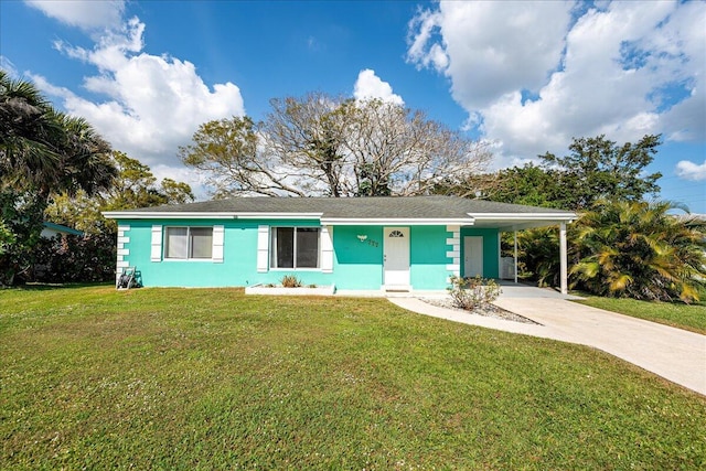 ranch-style house featuring a carport and a front yard