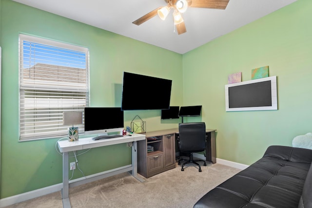 carpeted home office with ceiling fan