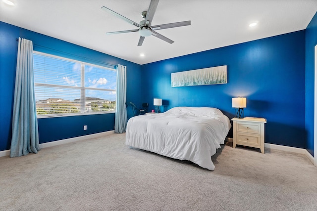 carpeted bedroom with ceiling fan