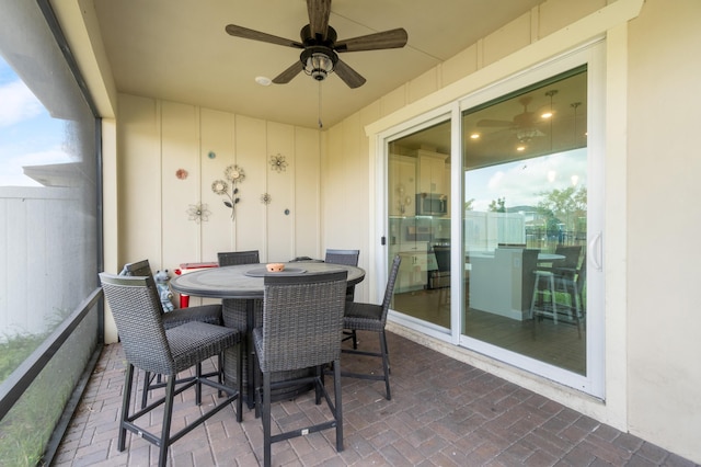 sunroom / solarium with ceiling fan