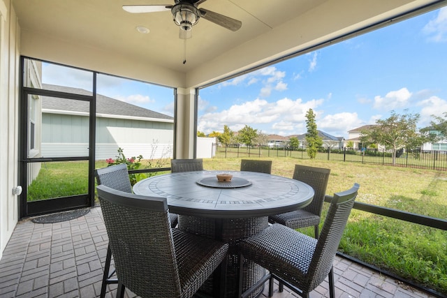 sunroom / solarium with ceiling fan