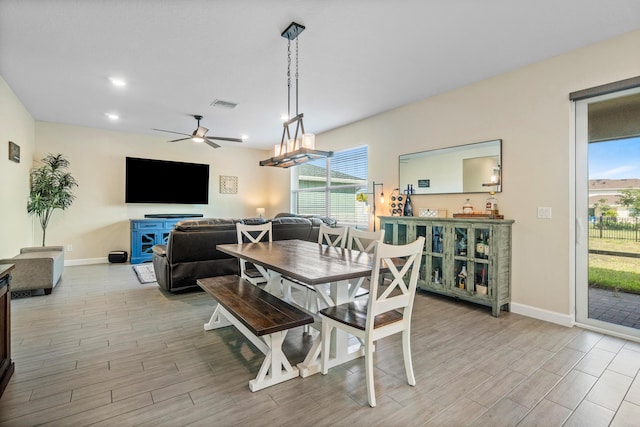 dining area featuring ceiling fan and light wood-type flooring