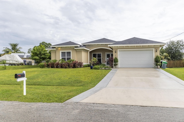 view of front of home with a garage and a front yard