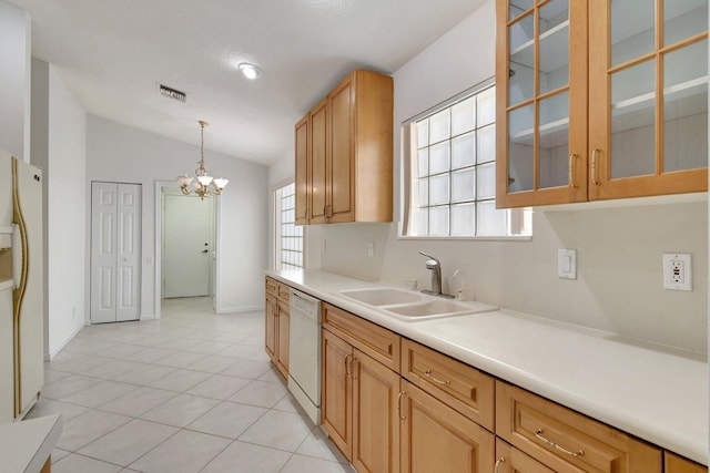 kitchen featuring vaulted ceiling, light tile patterned flooring, sink, hanging light fixtures, and white appliances