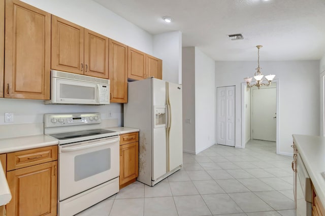 kitchen featuring white appliances, visible vents, light countertops, a chandelier, and pendant lighting