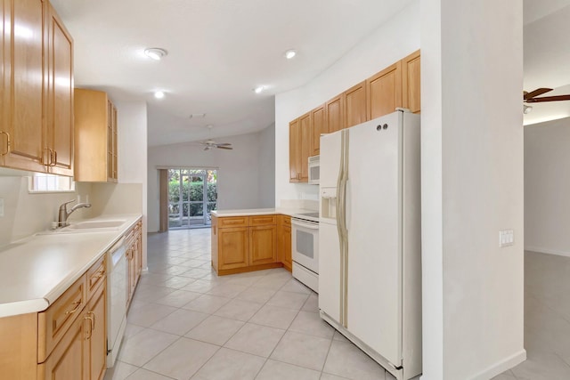 kitchen with white appliances, ceiling fan, a peninsula, light countertops, and a sink