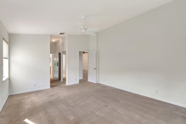 carpeted empty room featuring ceiling fan