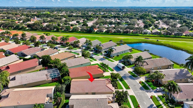 aerial view featuring a residential view and a water view