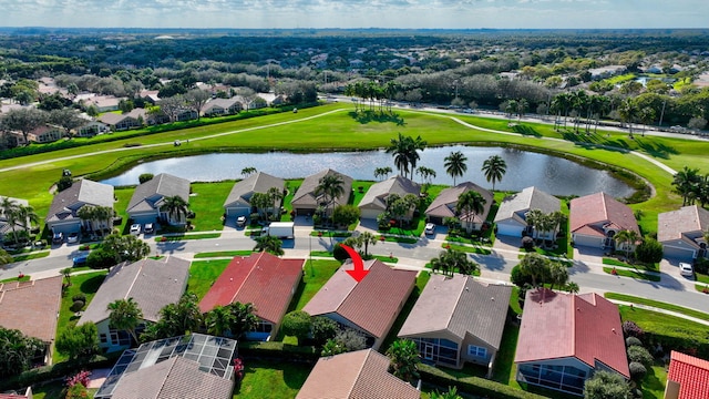 birds eye view of property with a residential view, view of golf course, and a water view