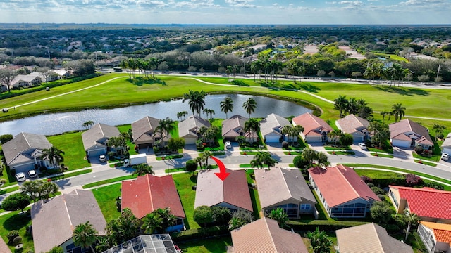 aerial view featuring a water view, a residential view, and golf course view