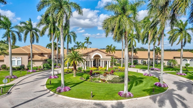 view of property featuring a residential view and driveway