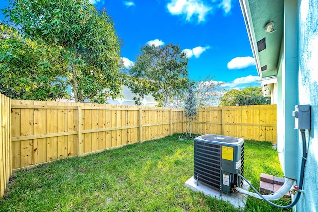 view of yard featuring central air condition unit