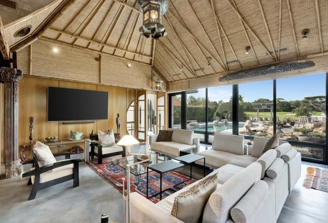 sunroom featuring vaulted ceiling and wood ceiling