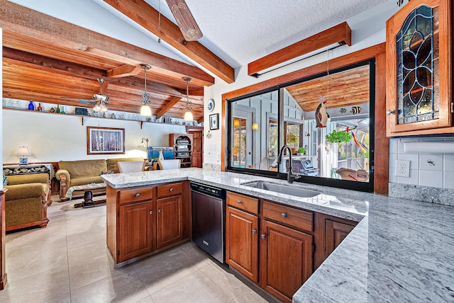 kitchen with sink, light stone countertops, decorative light fixtures, stainless steel dishwasher, and kitchen peninsula