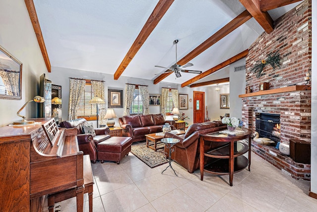 tiled living room with lofted ceiling with beams, a brick fireplace, and ceiling fan