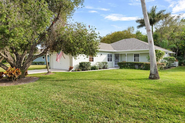 ranch-style home featuring a garage and a front yard