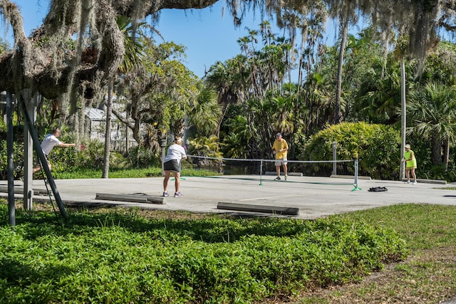 view of home's community featuring volleyball court