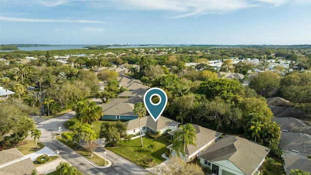 birds eye view of property featuring a water view