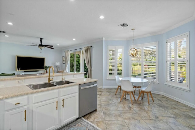 kitchen featuring visible vents, light countertops, ornamental molding, stainless steel dishwasher, and a sink