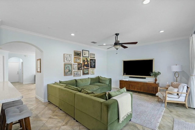 living area featuring crown molding, recessed lighting, arched walkways, and visible vents