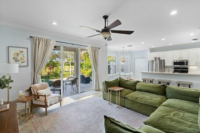 living room with light tile patterned floors, recessed lighting, and crown molding