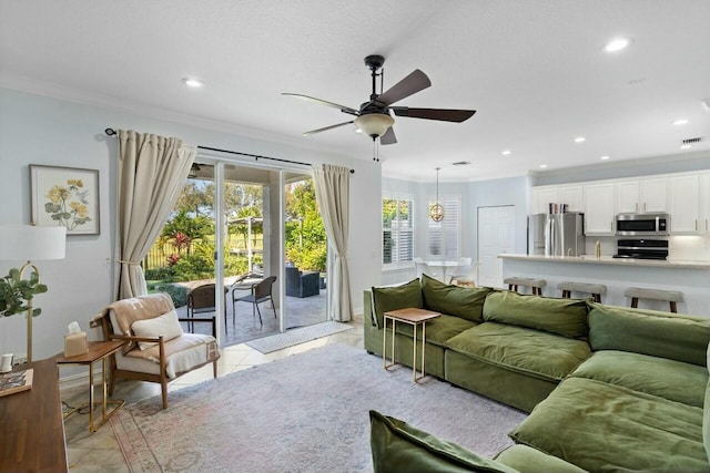 8877 Kettle Drum Ter, Boynton Beach, FL 33473 - living room with light tile patterned floors, visible vents, ceiling fan, ornamental molding, and recessed lighting