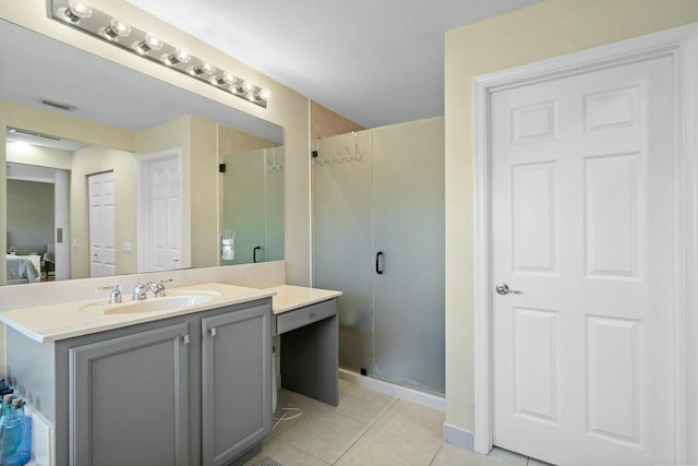 8877 Kettle Drum Ter, Boynton Beach, FL 33473 - ensuite bathroom with a stall shower, ensuite bathroom, visible vents, tile patterned flooring, and vanity
