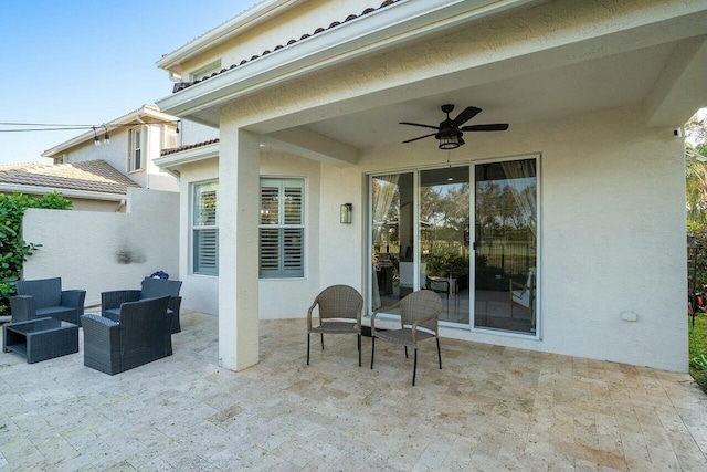 view of patio with an outdoor hangout area and ceiling fan