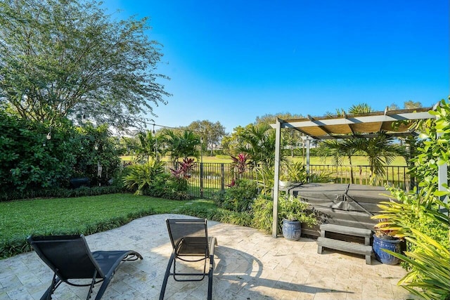 view of patio / terrace with a pergola and fence