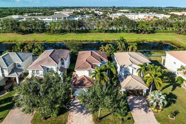 bird's eye view featuring a residential view and a water view