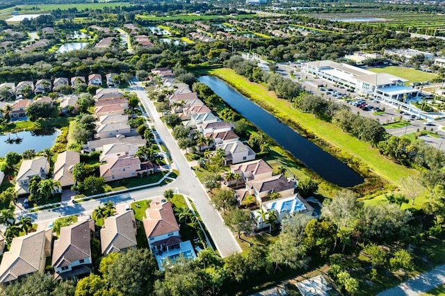 birds eye view of property with a residential view and a water view