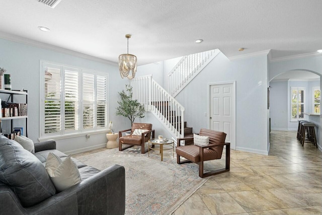 living area with stairway, arched walkways, baseboards, and ornamental molding