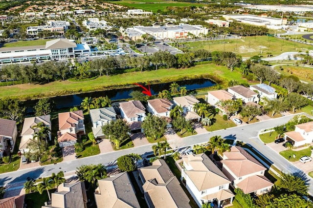 bird's eye view with a water view and a residential view