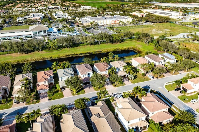 bird's eye view with a residential view and a water view