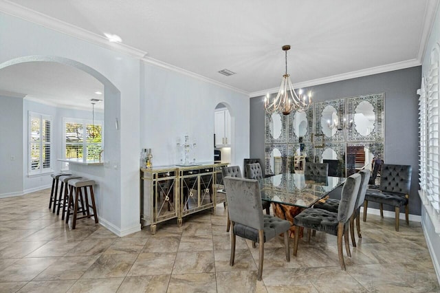 8877 Kettle Drum Ter, Boynton Beach, FL 33473 - dining space with a chandelier, crown molding, arched walkways, and visible vents