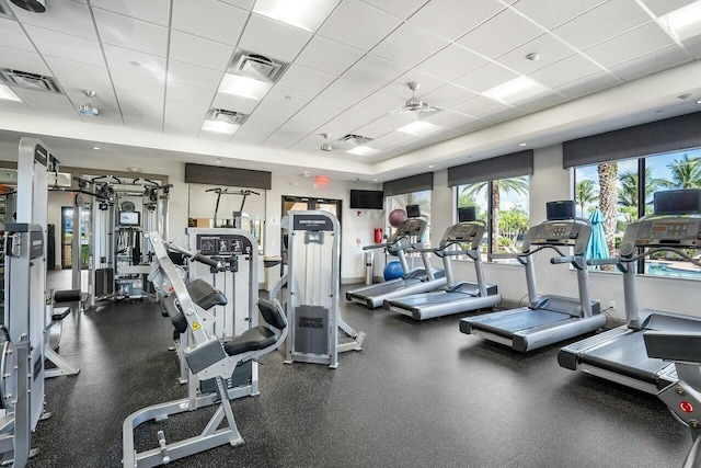 gym with a drop ceiling and visible vents