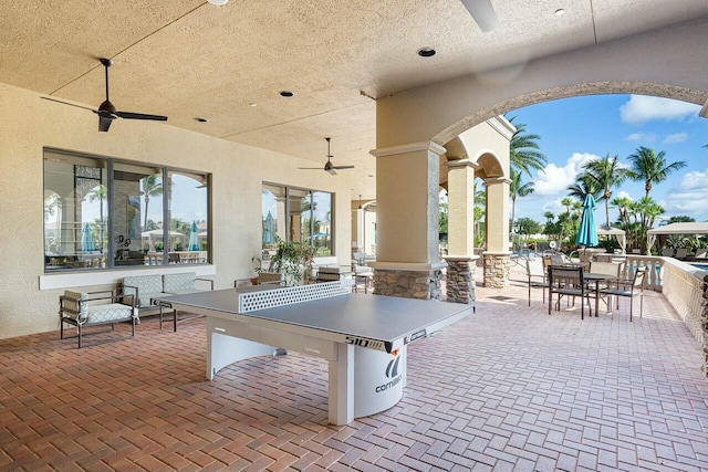 view of patio / terrace with outdoor dining space and a ceiling fan