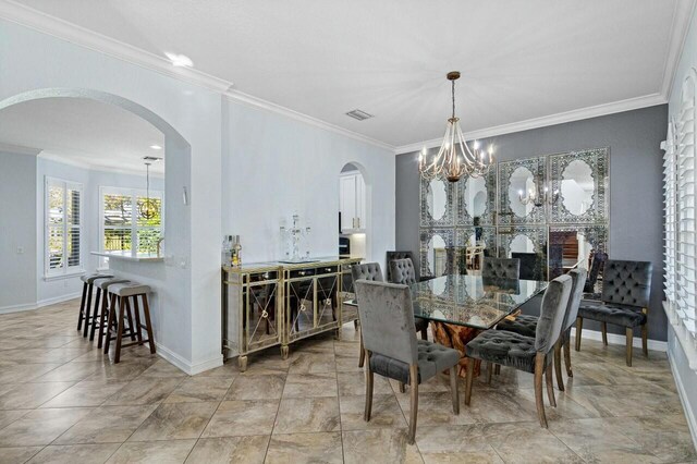 8877 Kettle Drum Ter, Boynton Beach, FL 33473 - dining room featuring arched walkways, a chandelier, ornamental molding, and baseboards