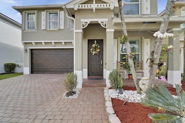 doorway to property with a garage