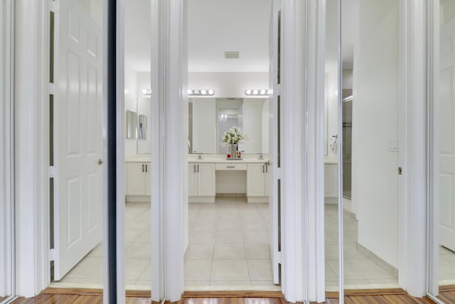 bathroom featuring tile patterned floors and vanity