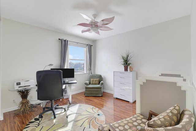 office space featuring ceiling fan and light hardwood / wood-style flooring