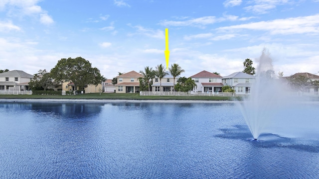 view of swimming pool featuring a water view