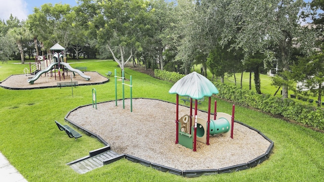 view of playground with a lawn