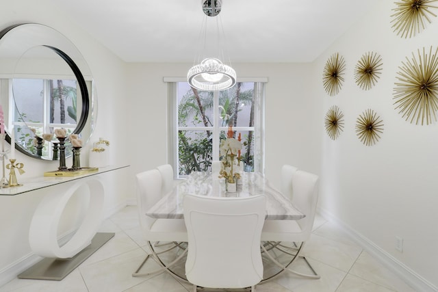 tiled dining space with a notable chandelier