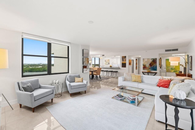 tiled living room featuring a wealth of natural light